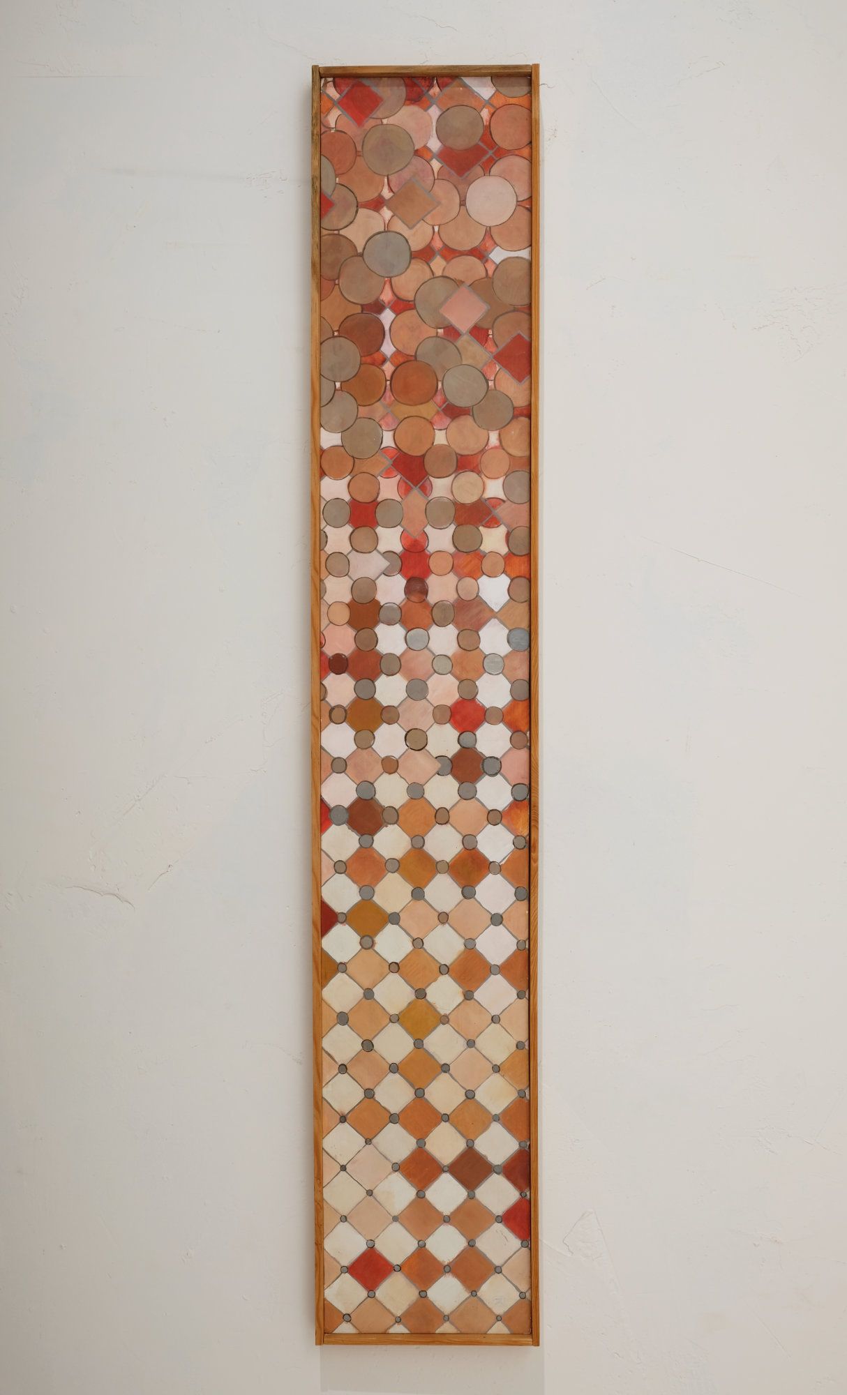 Tall narrow oil on gesso panel painting with overlapping circles and diamond shapes in warm earth tones of coral, orange, rust, cream, and brown, transitioning from dense clustered forms at top to an open grid pattern below.