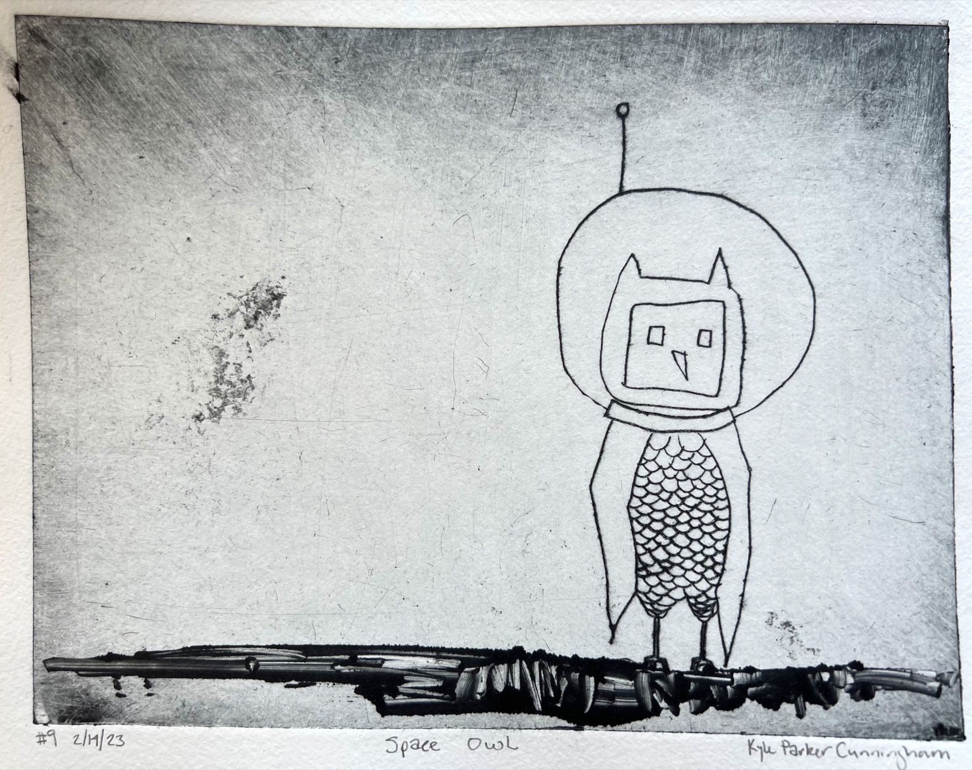 Intaglio drypoint print of a whimsical owl wearing a round space helmet with an antenna, its body covered in scale-like feathers, standing on a dark rocky surface against a scratchy gray background on handtorn paper.