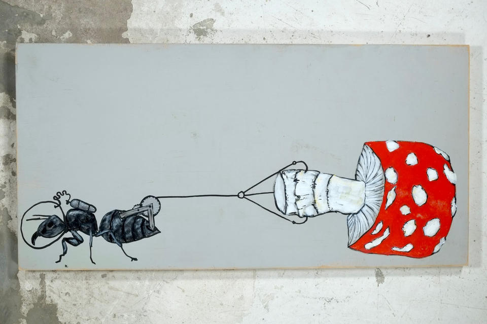 Acrylic painting on found panel of an ant with a jetpack using a winch and pulley to haul a red-and-white spotted Amanita muscaria mushroom across a gray background.