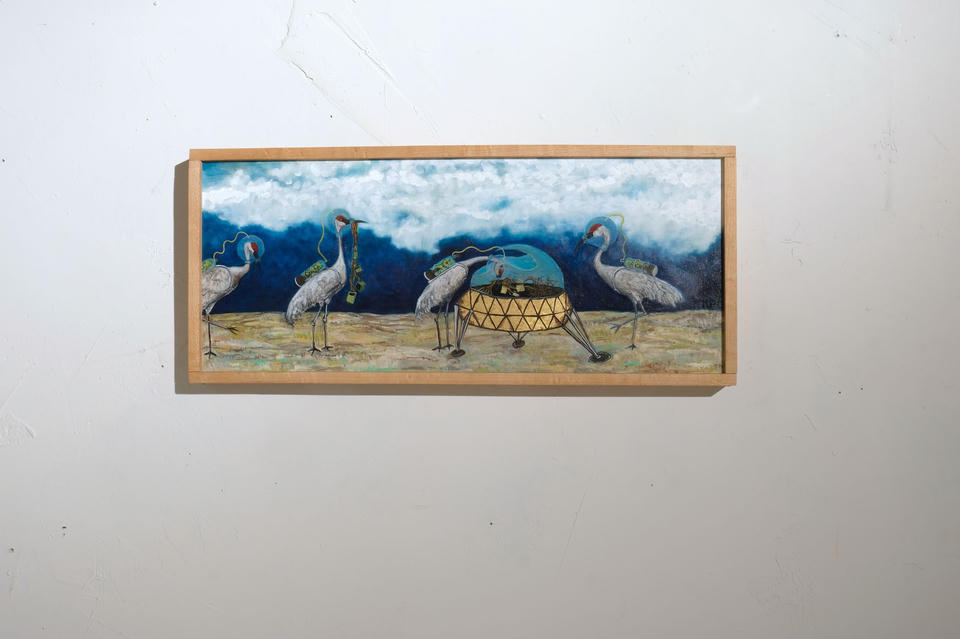 Panoramic oil on linen painting of sandhill cranes scavenging parts from a domed spacecraft on sandy ground, set against a deep blue sky with white clouds.