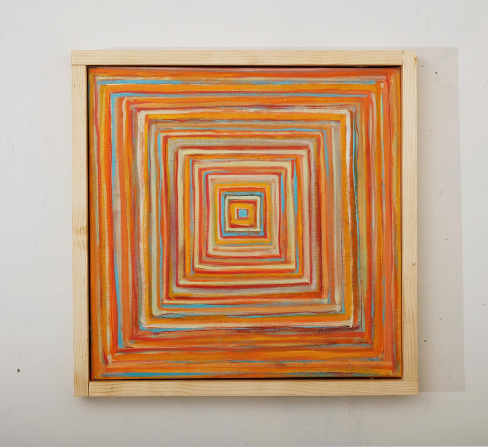 Oil painting of concentric squares in warm tones of orange, red, yellow, and turquoise blue, radiating inward to a small central square, creating a hypnotic tunnel-like composition in a light wooden frame.